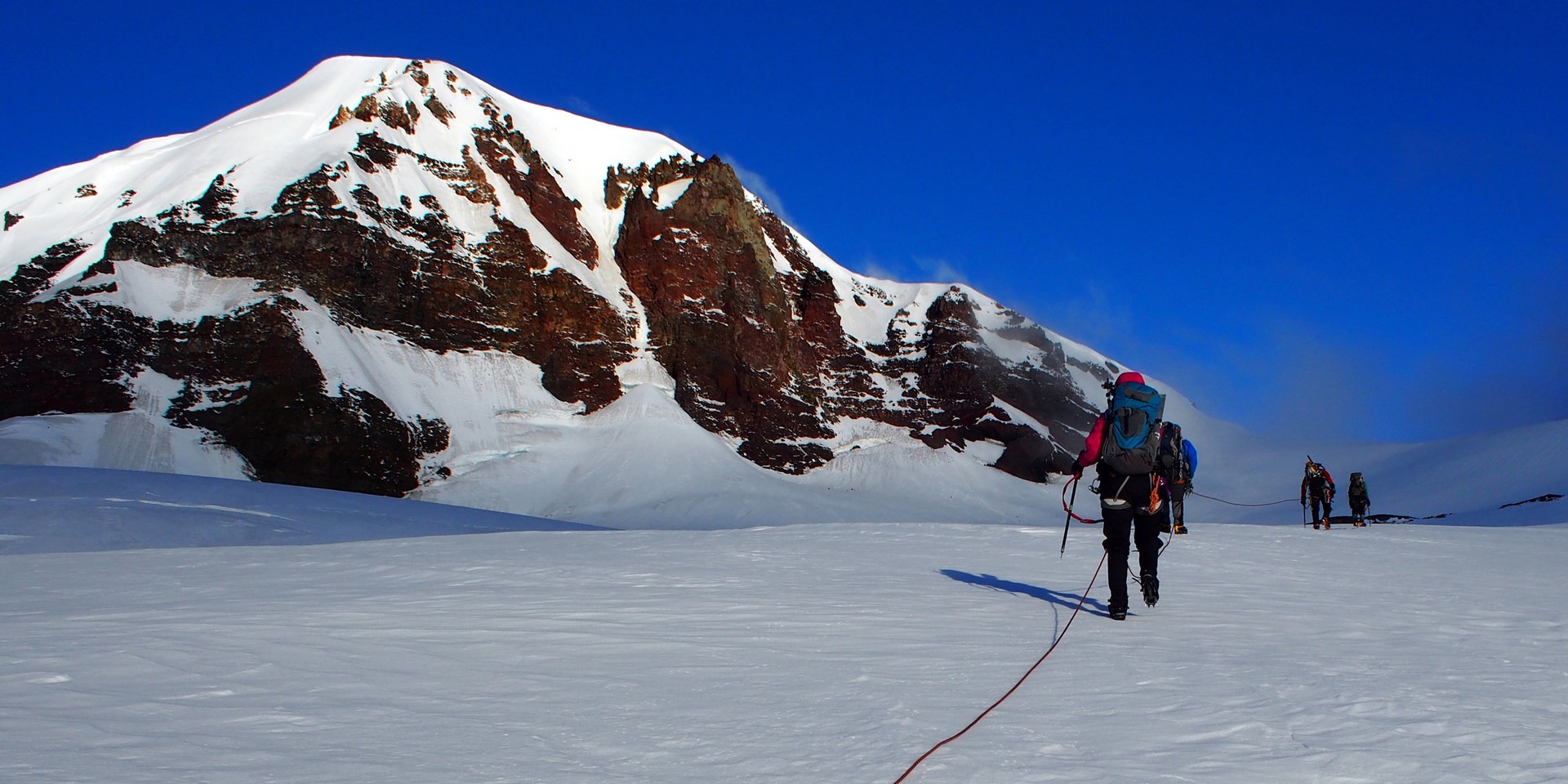 Crossing the Haden Glacier with Middle Sister in background.
