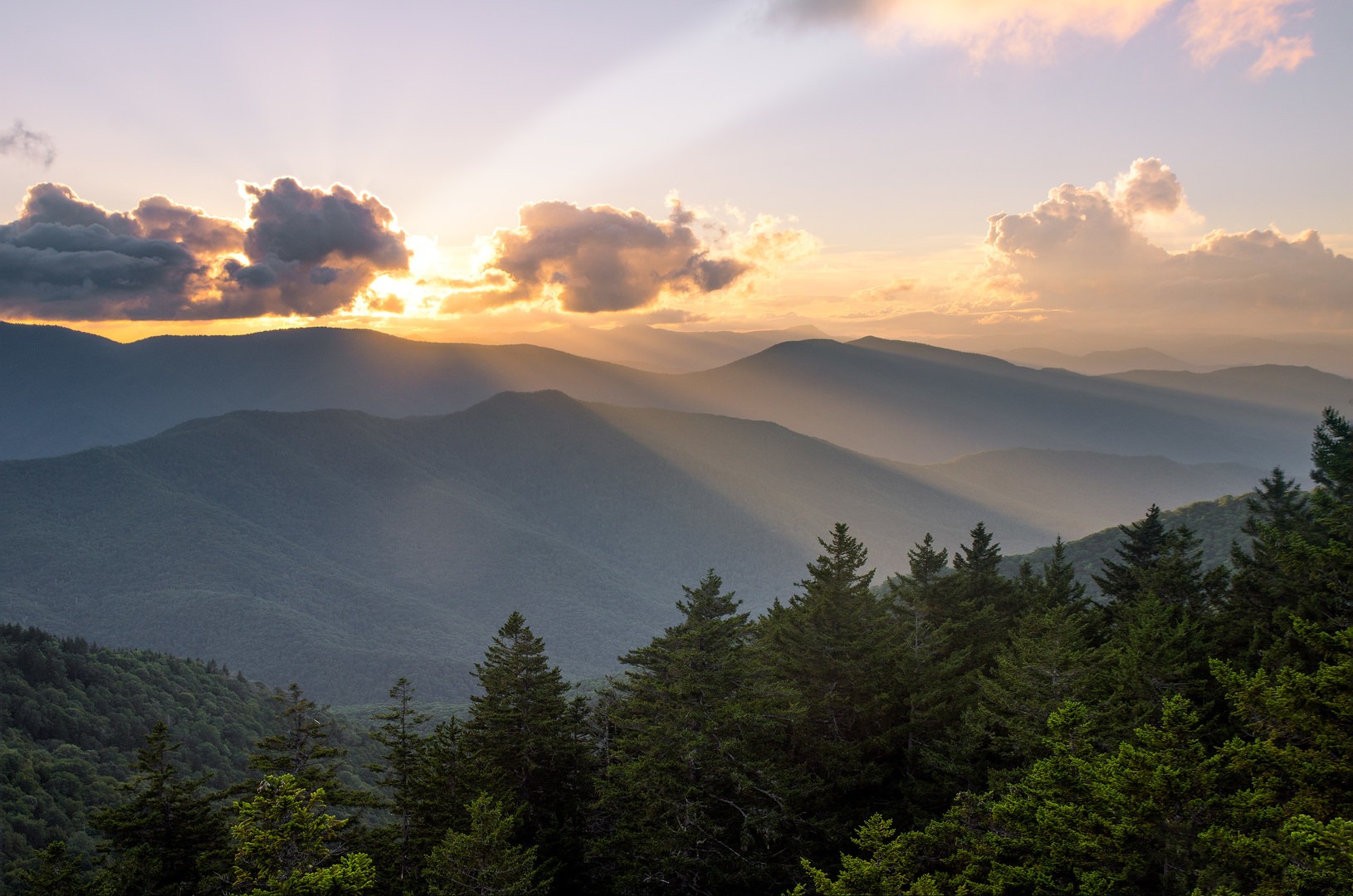 The view looking west from Shining Rock summit is hard to beat. Plan to catch the sunset from the large white quartzite rock!