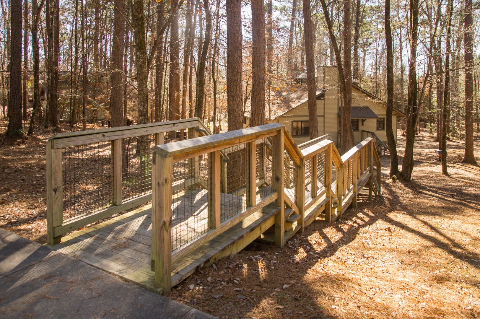 A set of stairs leading to one of the cozy cabin rentals.