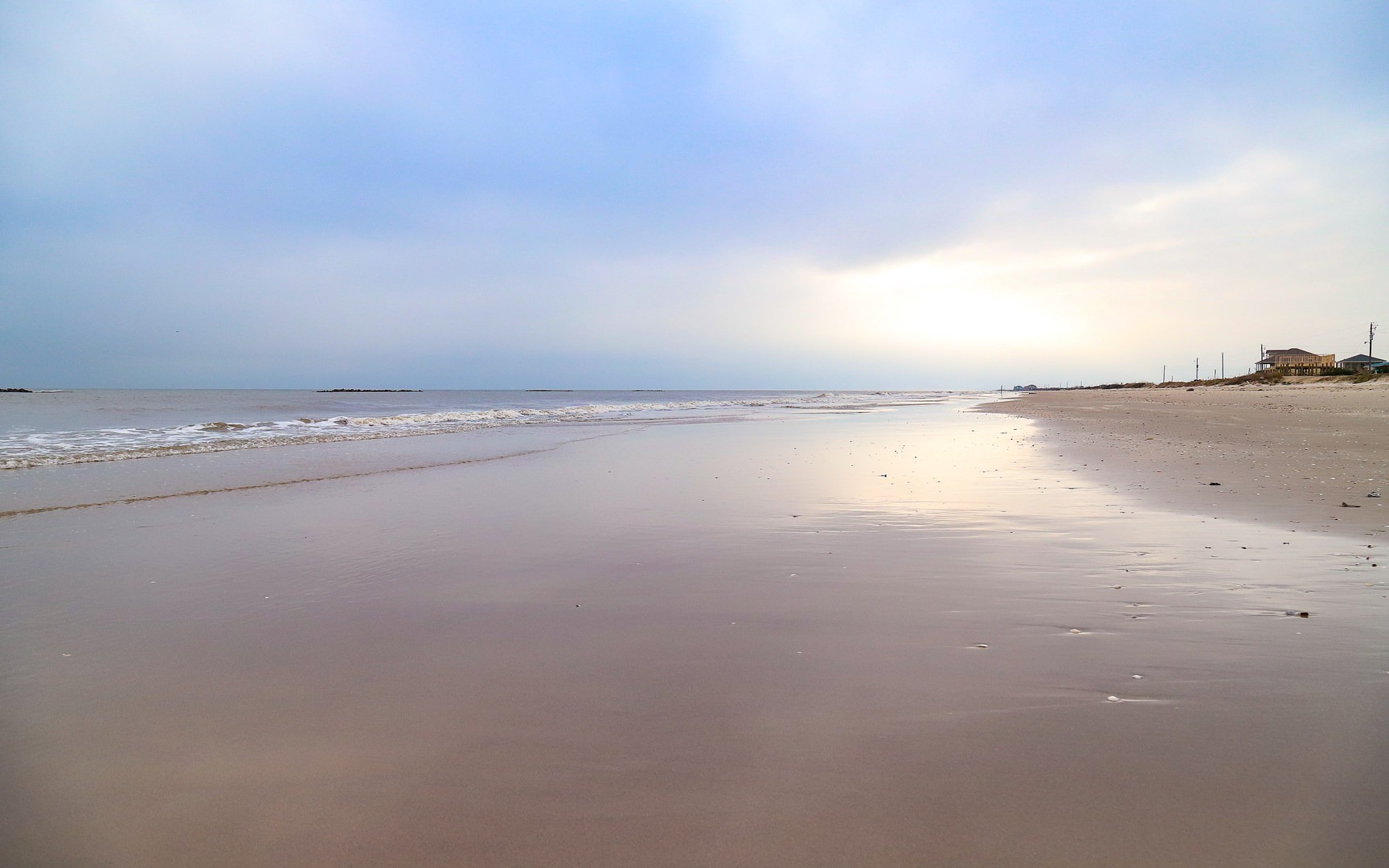 Smooth sandy shores stretch along the Gulf Coast in this area.