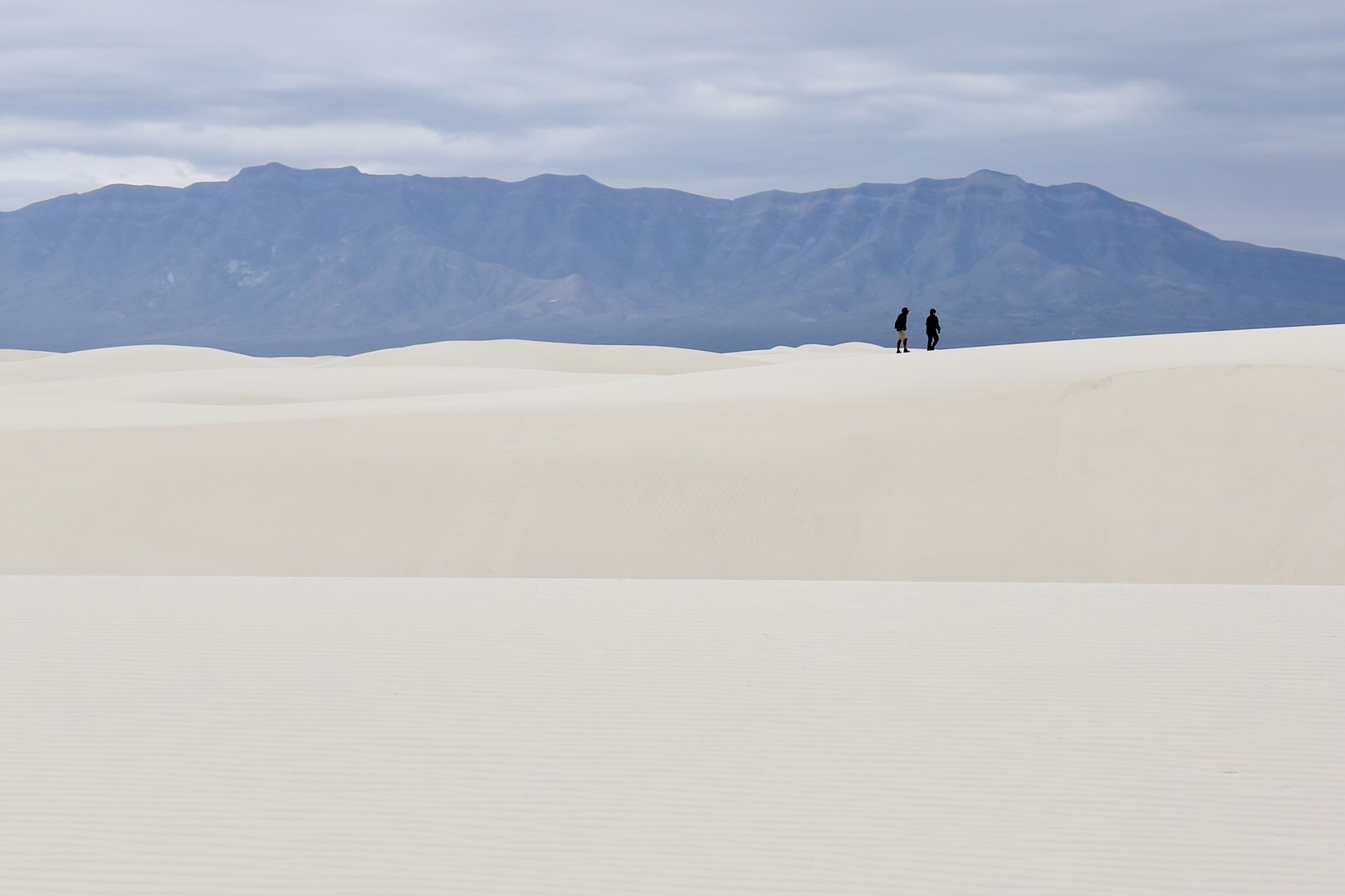 Hiking the Alkali Flat Trail in White Sands National Monument.