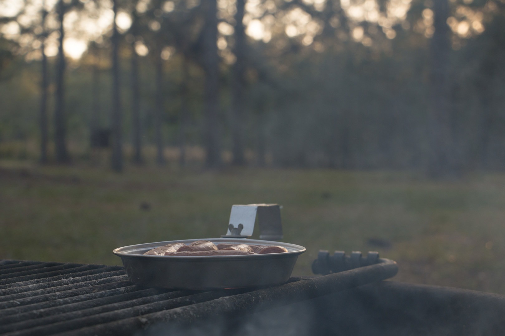 Cooking dinner on the fire.