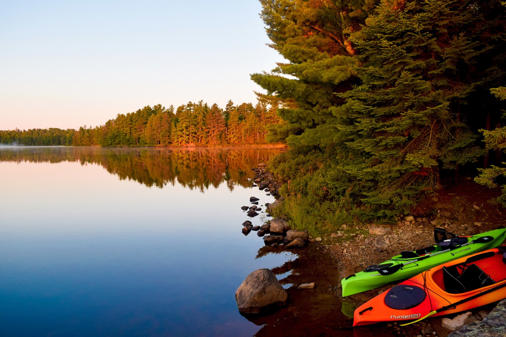 Sunrise lights up the reflections of cool BWCA morning.
