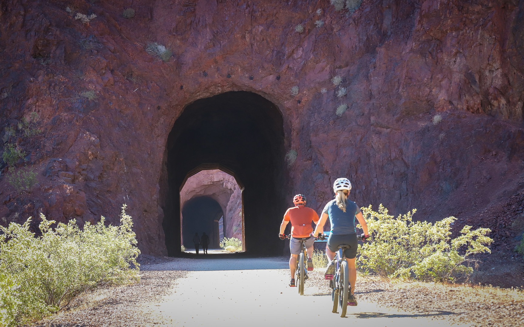 The first of five tunnels along the trail. Cycling the level grade is a popular activity.