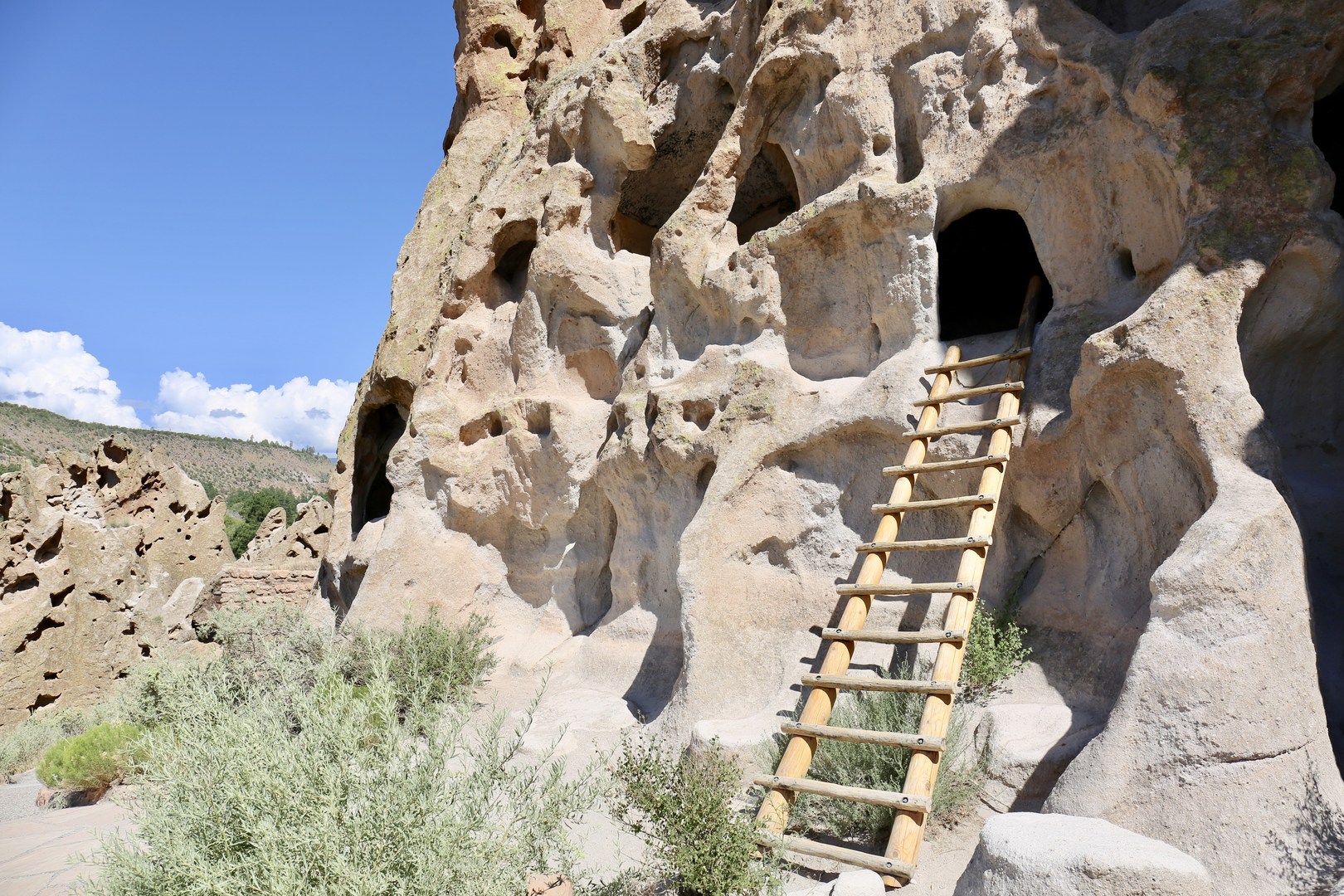 Hikers can climb into the cliff dwellings.