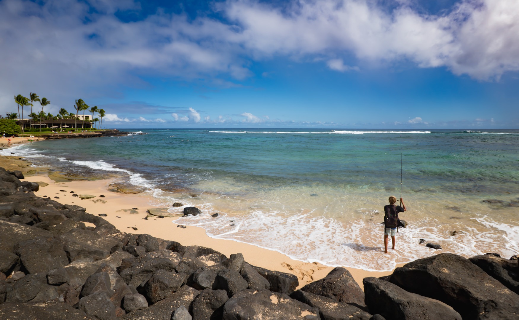 The shore is rocky along the western side, but much more sandy along the eastern side.