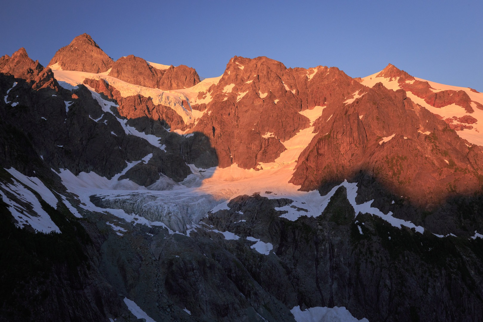 Evening alpenglow on Mount Shuksan from a campsite at Lake Ann with the hanging Lower Curtis Glacier.