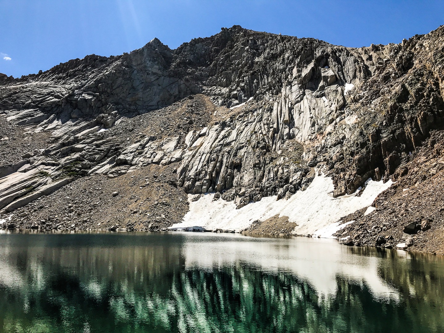 Crystal Lake is punctuated by a historic dam and has breathtaking peaks surrounding its entirety.