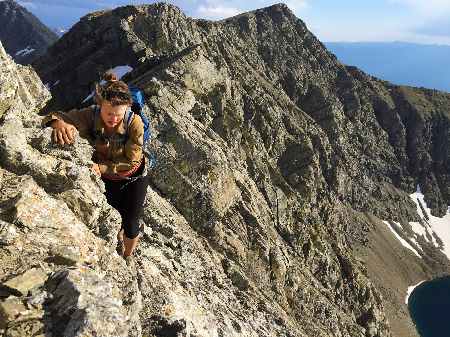 Contributor Amber McDaniel crossing the ridge between the south summit and Holland Peak.