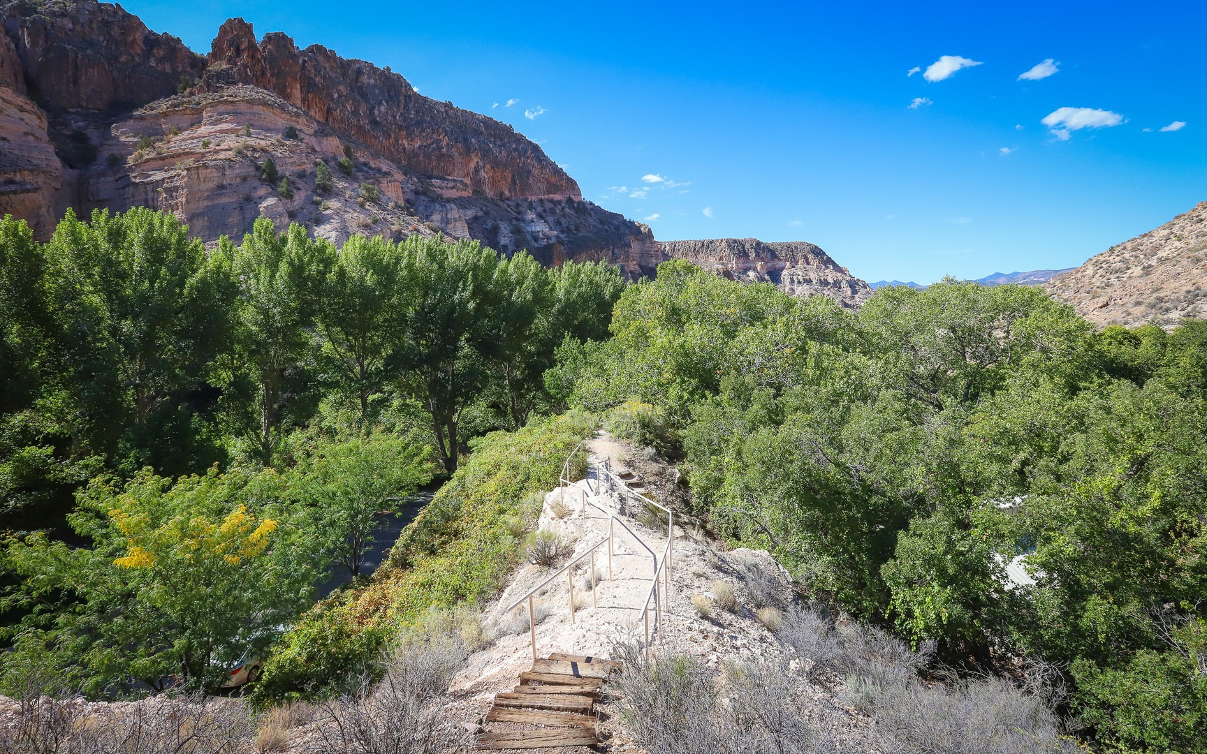 The trail crosses a stone spine as it descends back into the canyon.