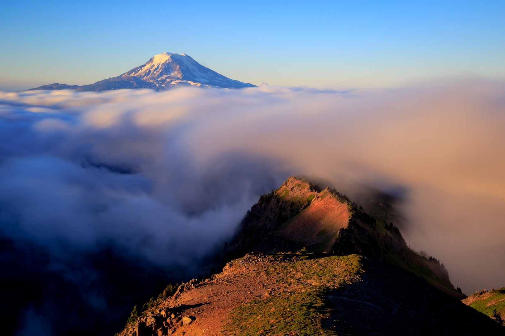 Long exposure revealing the spindrift over Goat Ridge with Mount Adams above.