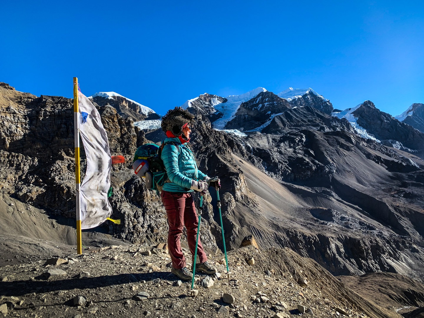 Vertical prayer flags line the trail on the way to Thorong La Pass, giving weary trekkers a dose of good fortune.