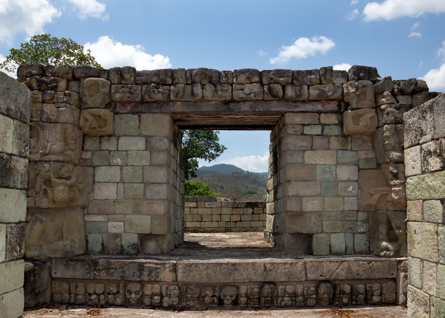 This exceptional view showcases the natural Honduran mountain scenery, framed by elaborate stone carvings.