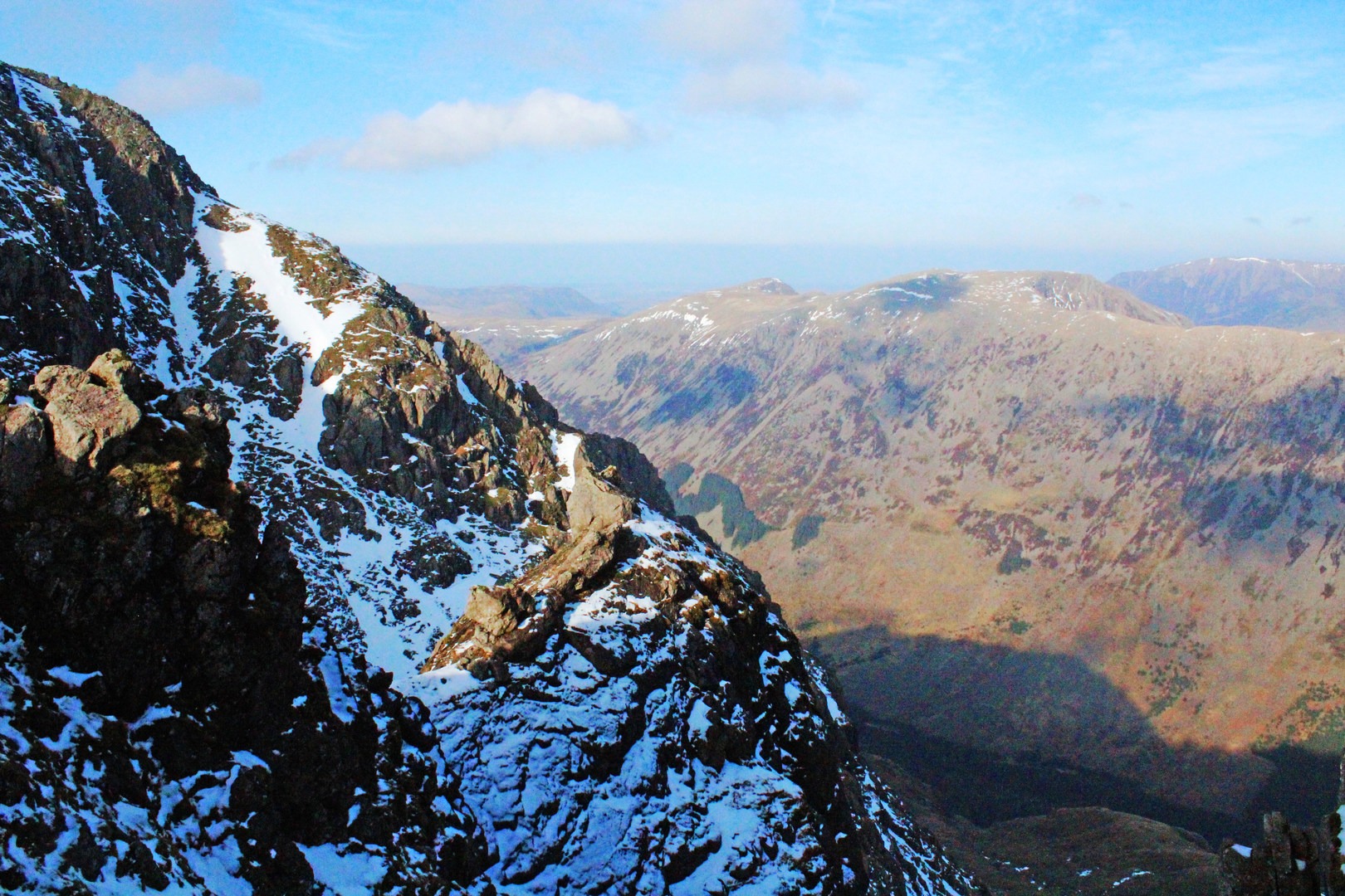 Looking down toward Ennerdale valley (where Ennerdale Water is hidden just around this rock mound) from Wind Gap.