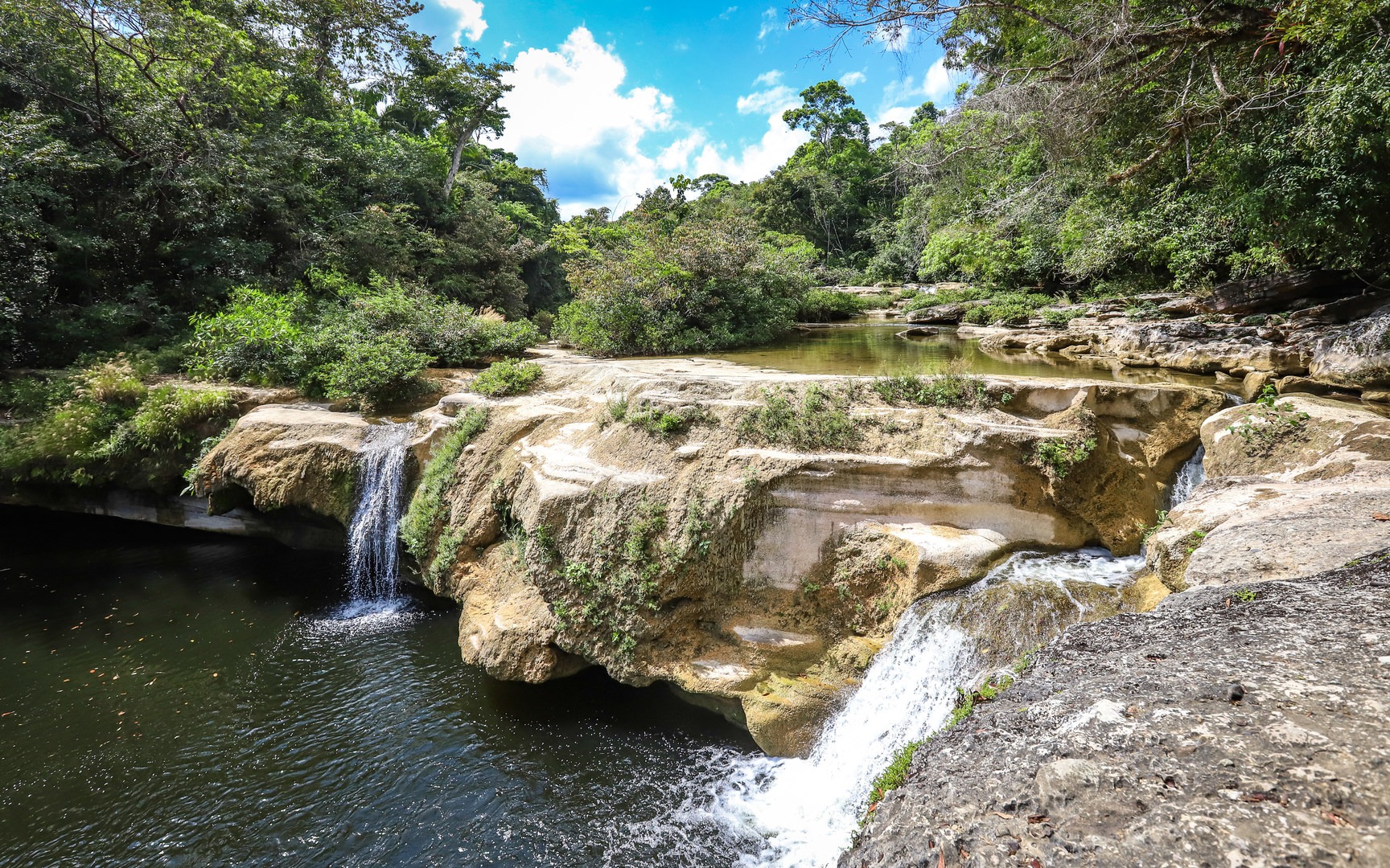 Rio Blanco Falls, where Blue Creek falls into a wide swimming area.