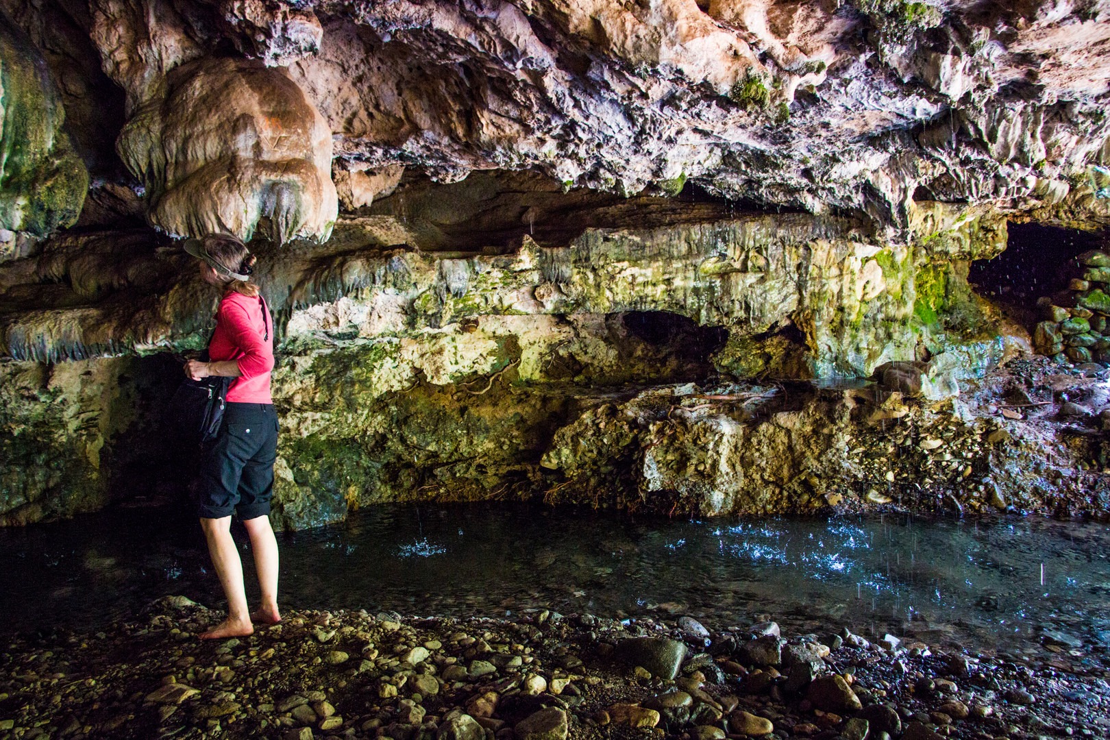 Geologist taking a peek at the rock formation underground.