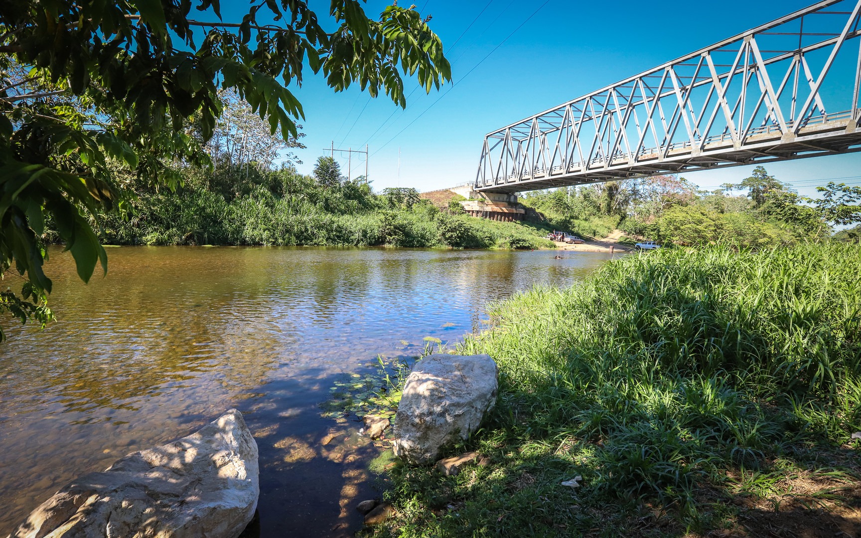 The river is wide and generally slow moving here, making a good spot for wading out into the water.