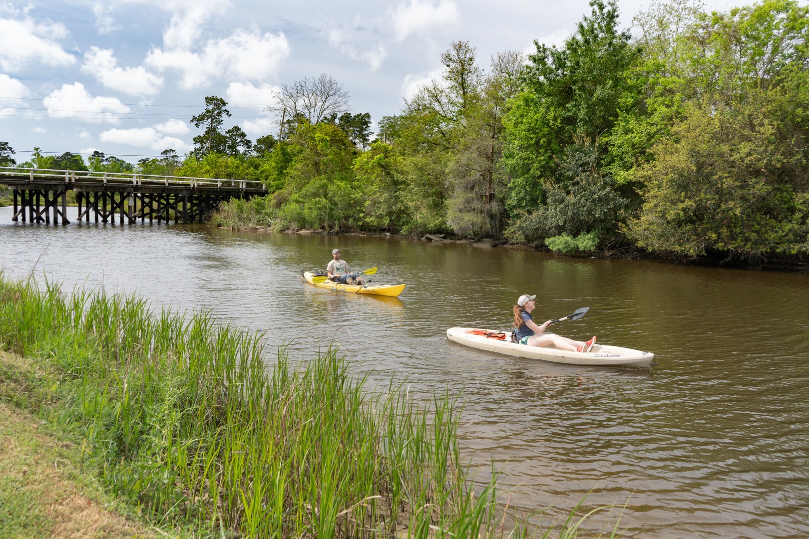 A pair of kayakers returning from a morning paddle up the canals.