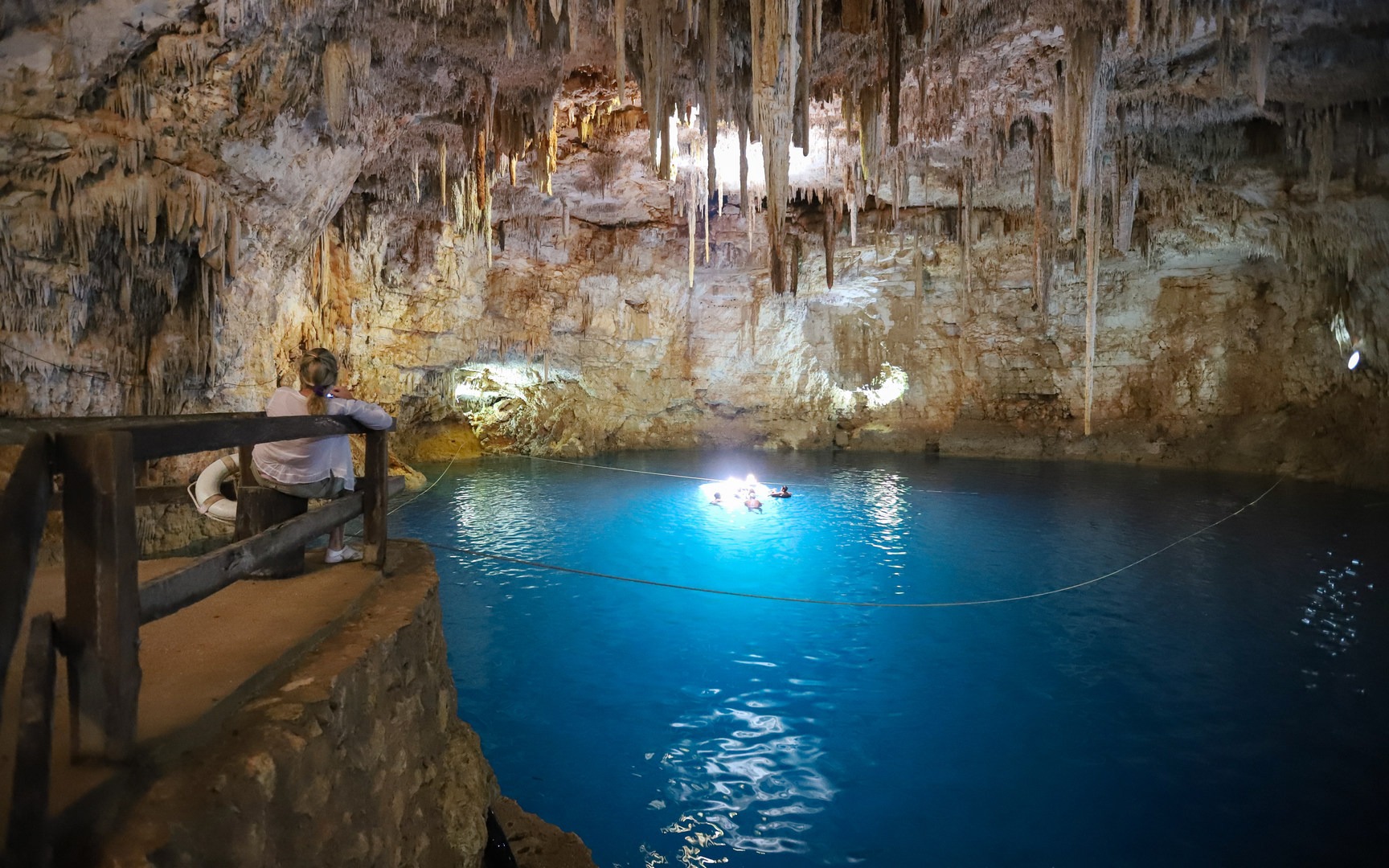 Cenote Palomitas has an otherworldly glow when the sunlight shines in through the ceiling.
