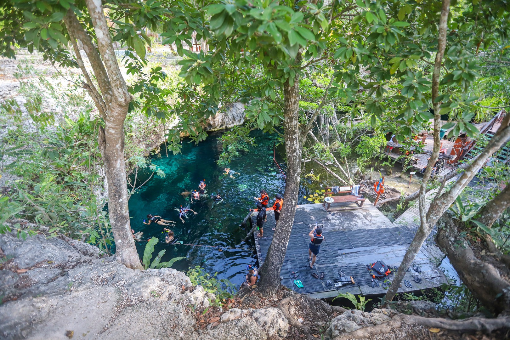 A view of swimmers in Gran Cenote.