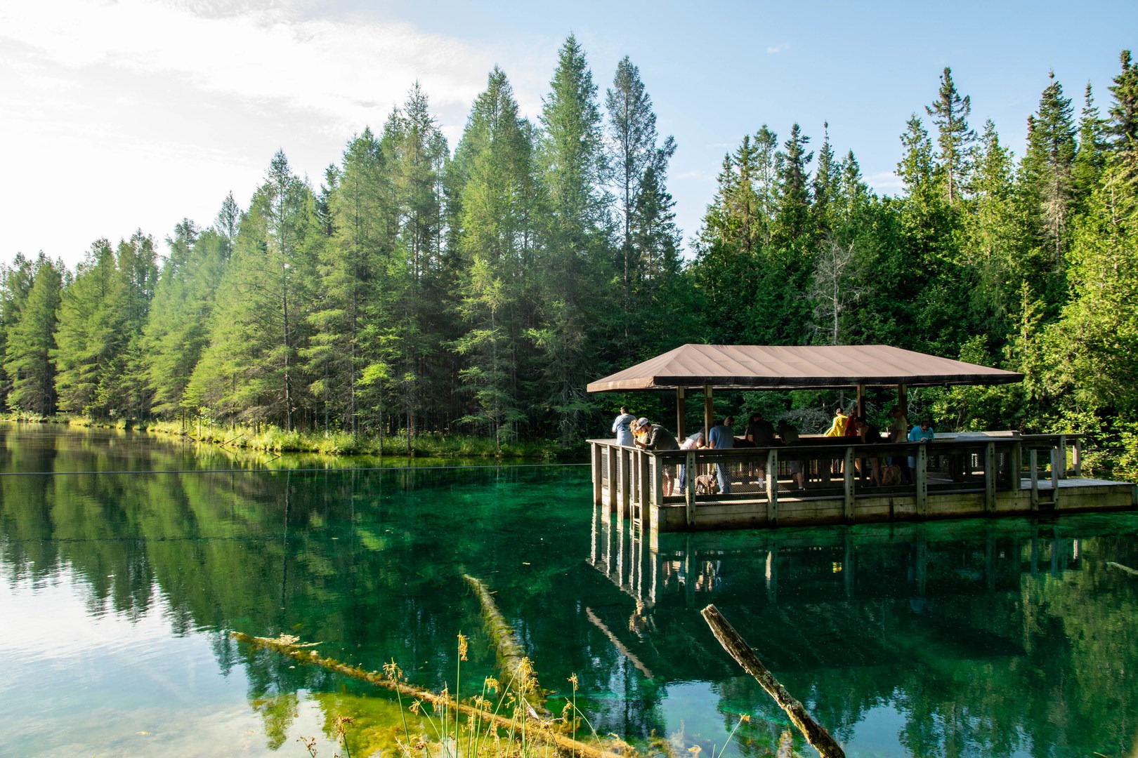The manually operated raft that allows visitors to look down into the spring from above at Kitch-iti-kipi.