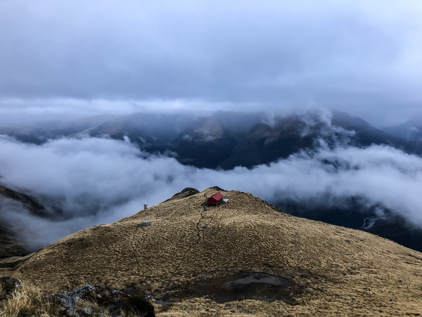 A view of the Brewster Hut in Mount Aspiring National Park from the climb up Mount Brewster.