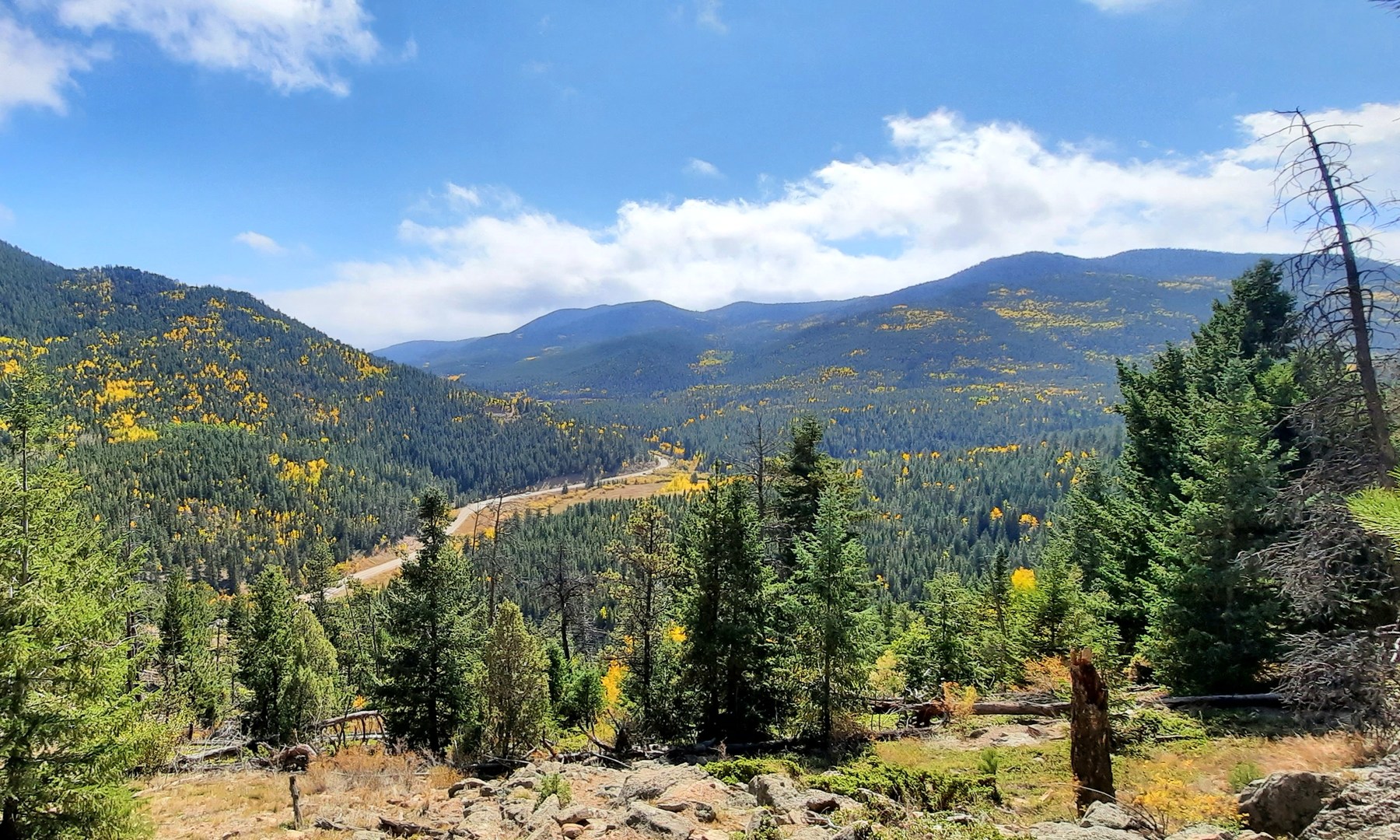 Soon the trail opens up to a larger vista of Crawford Gulch and Route 46.