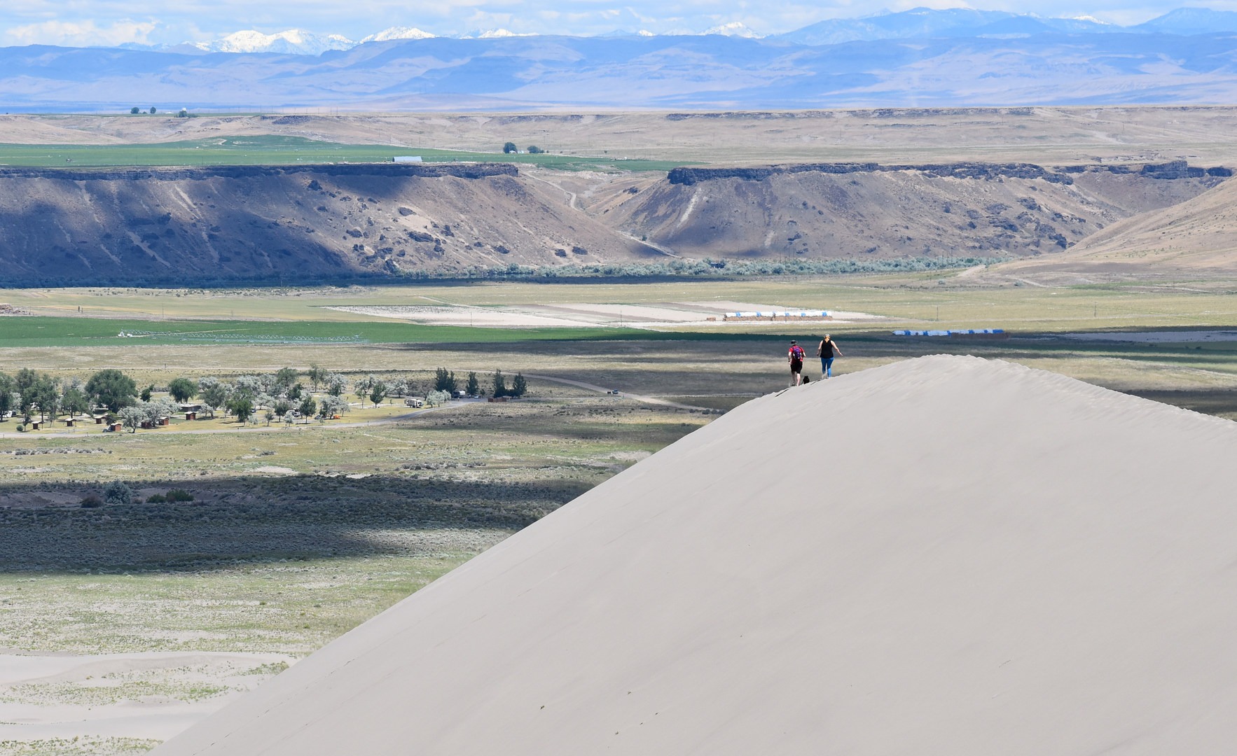 Hikers enjoying the landscape at Bruneau Dunes State Park.