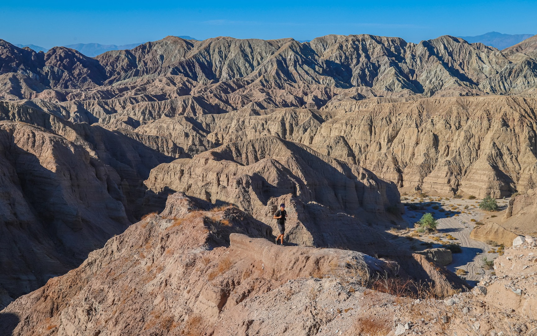 After climbing up to the ridge at the top of Little Painted Canyon, an elevated view gives a scenic perspective of the Mecca Hills landscape.