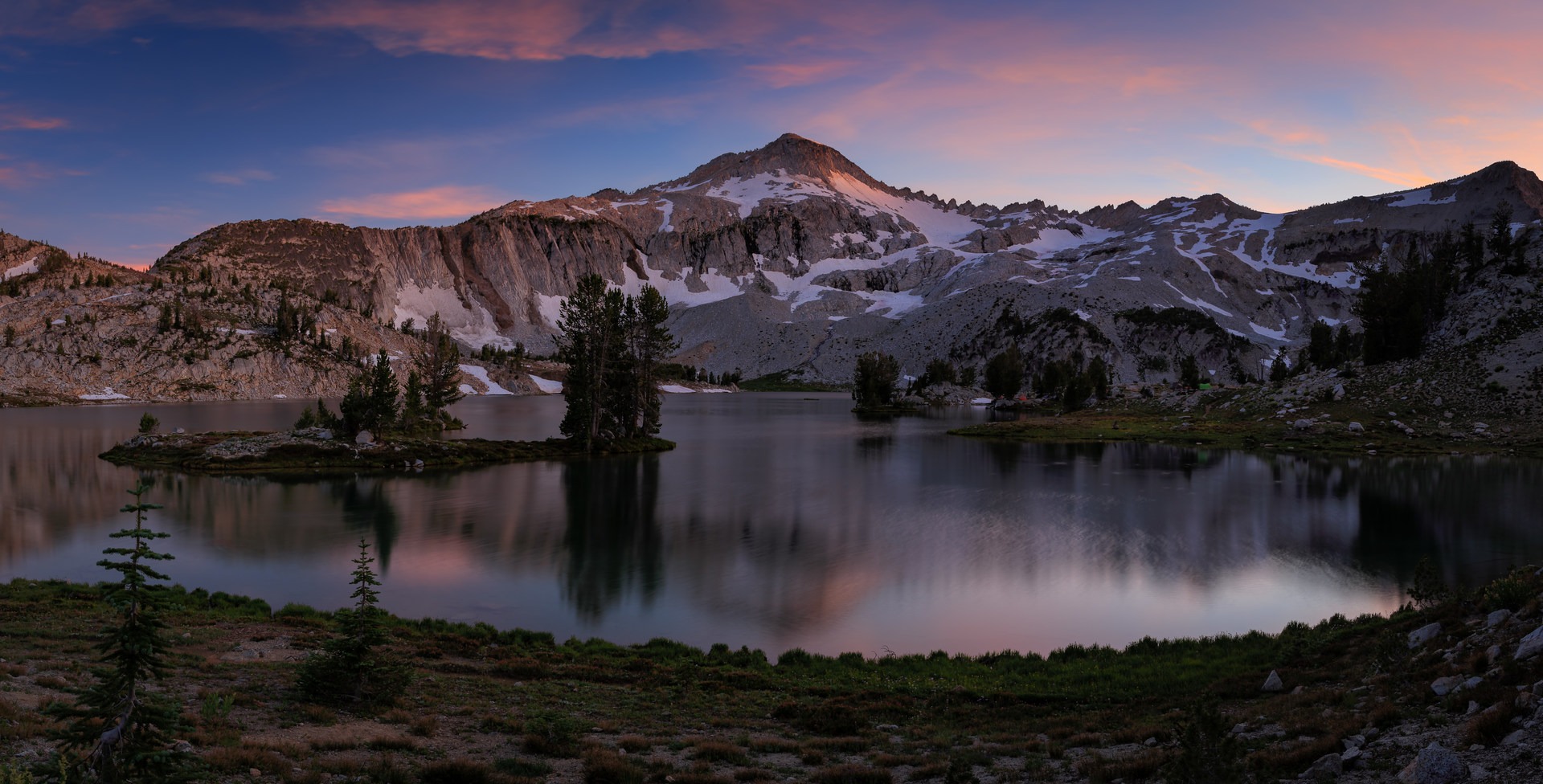 Colorful sunset over Glacier Peak and lake.