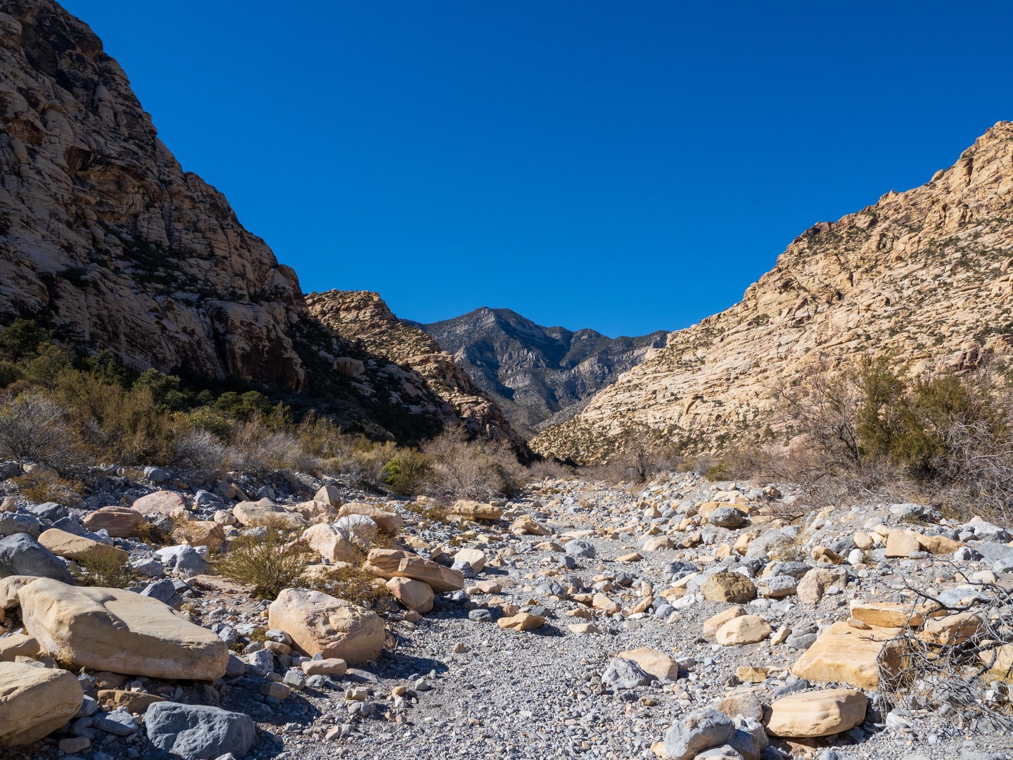 The trail crosses a dry wash twice.