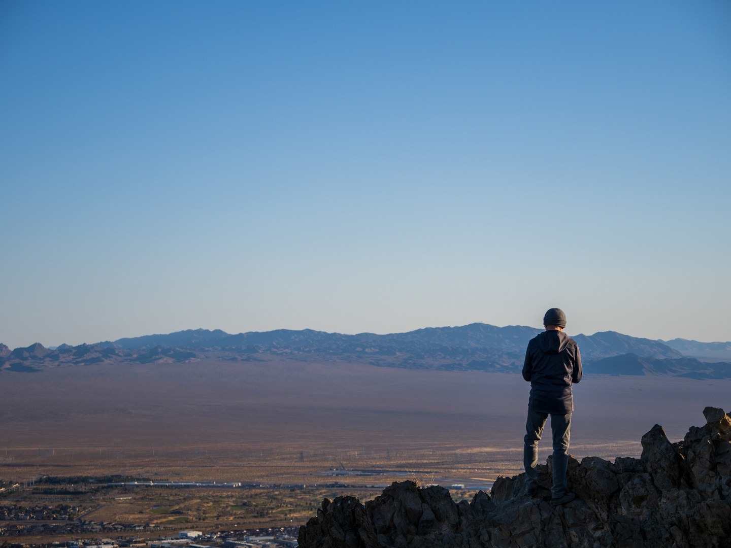 A hiker enjoying the summit views.