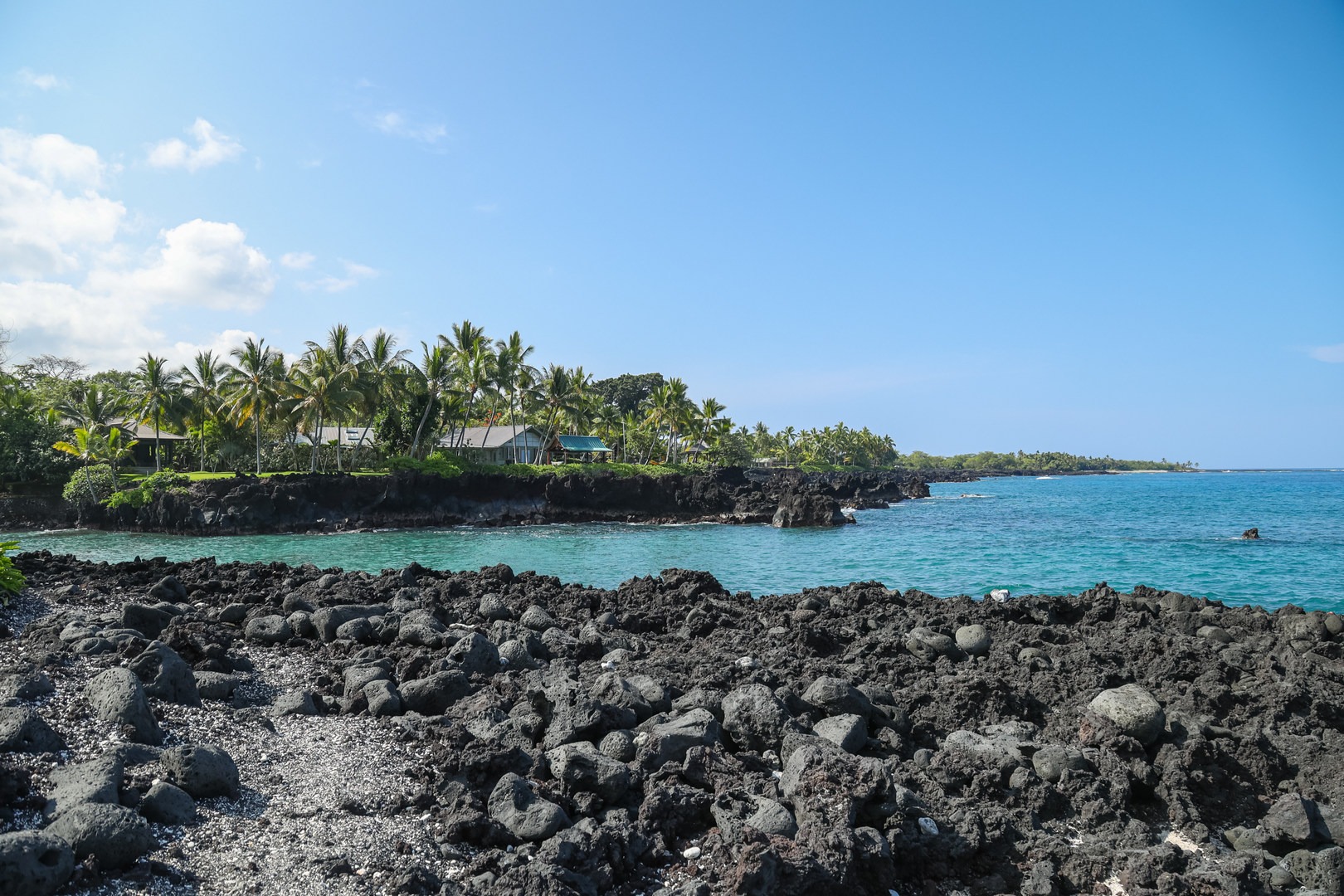 The beach itself has very limited sand, being mostly rocky shore perched above the sea.