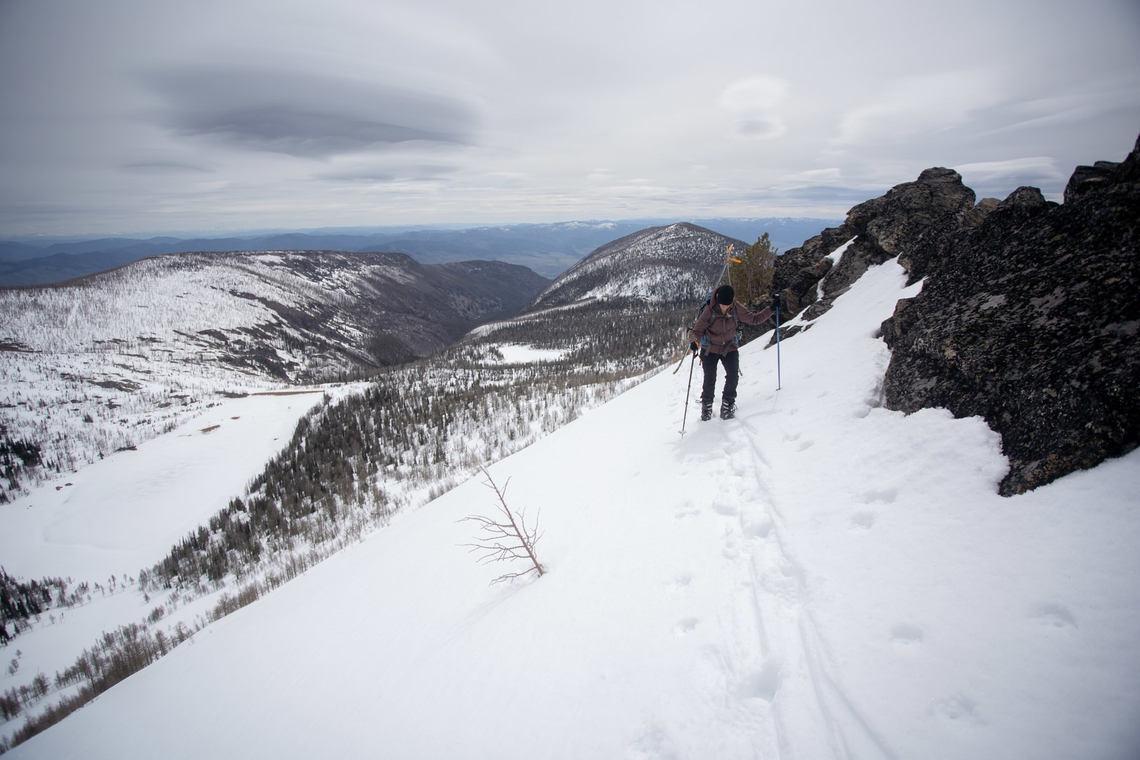 Booting along the ridge to the false summit.