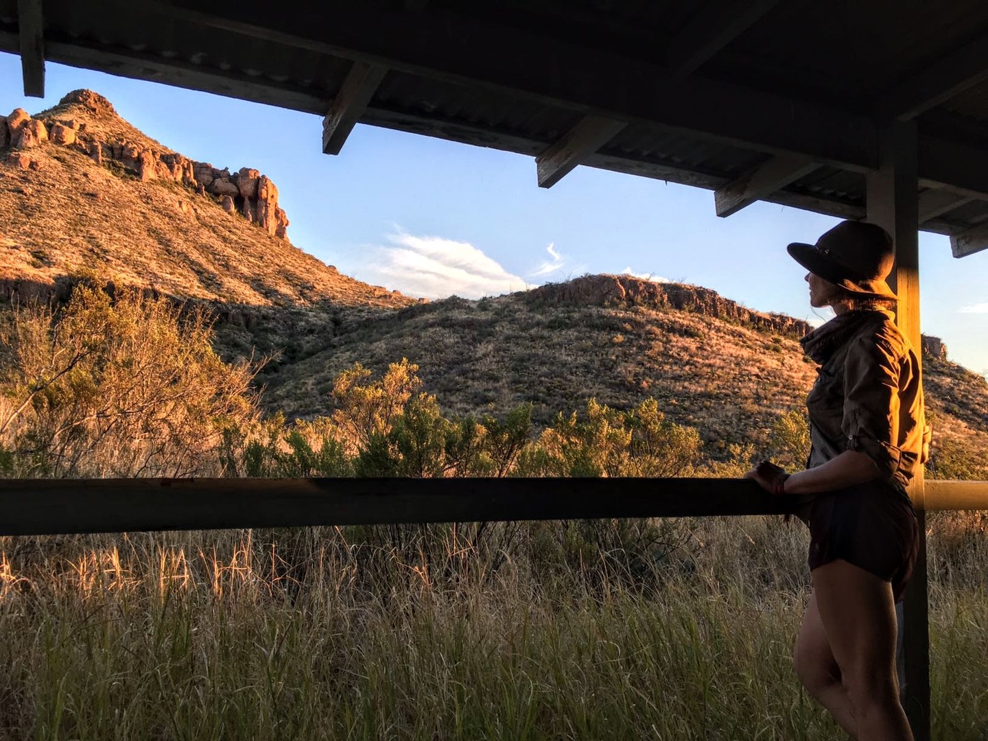 On the porch of the ranch.