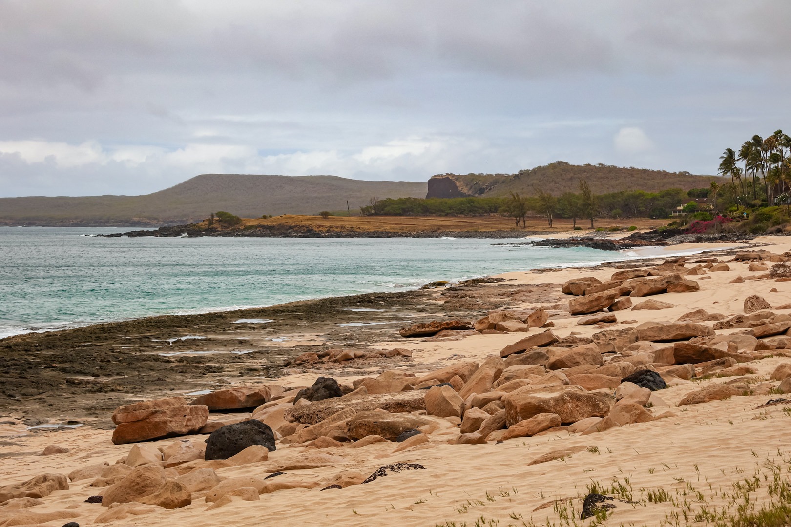 Kepuhi Beach stretches along a sandy shoreline on Moloka'i's western shore.