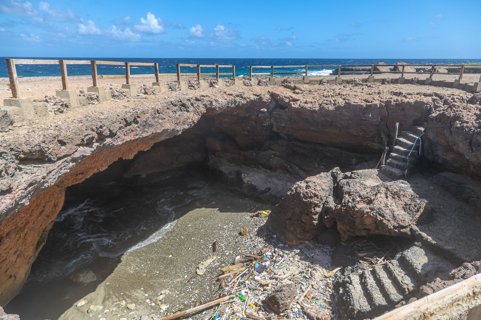 Stairs allow visitors to climb down into the cave.