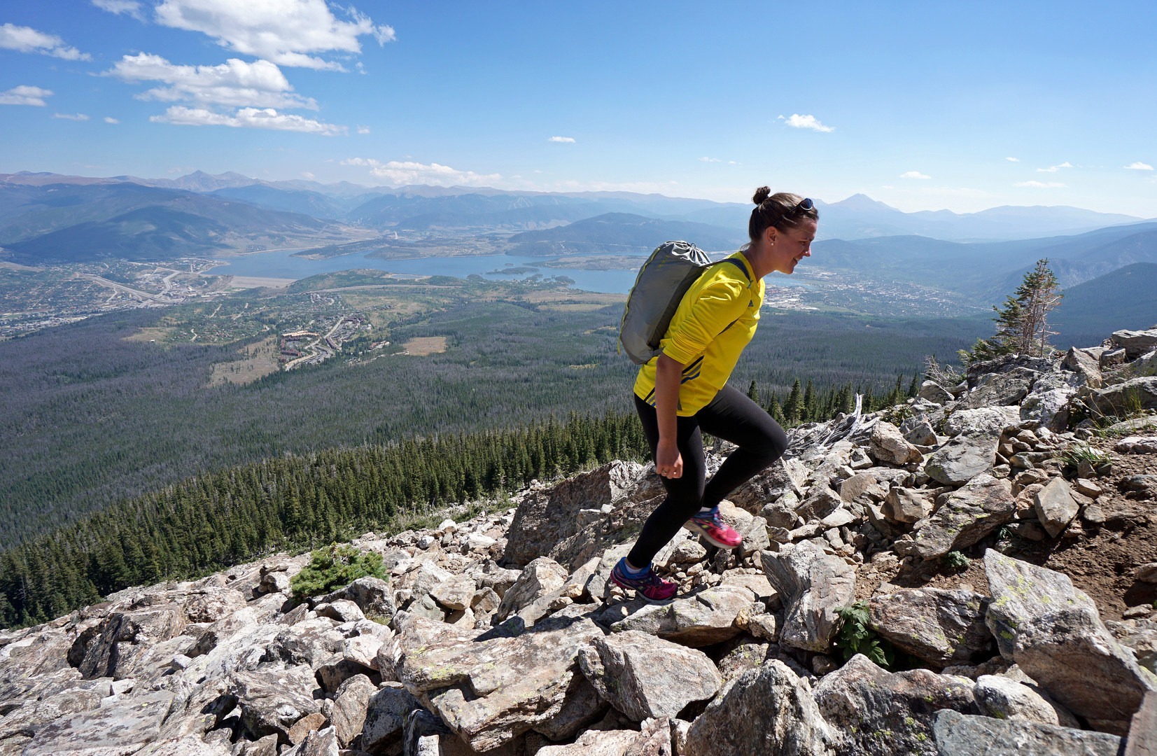 A hiker ascends up a boulder field on the northeastern slope of Buffalo Mountain near Dillon Reservoir.