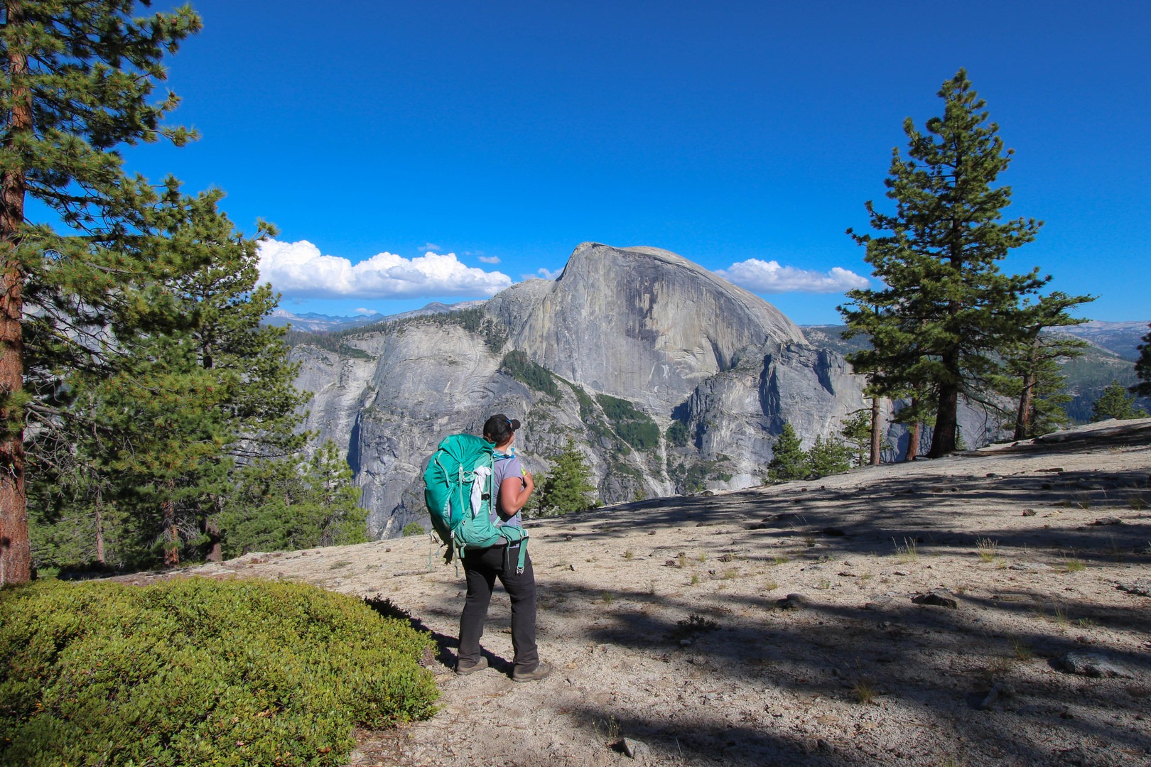 Backpacking Yosemite on North Dome overlooking Half Dome.