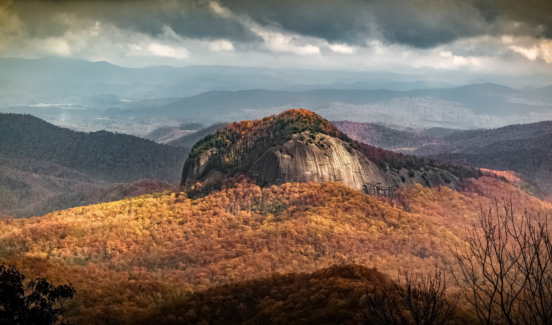 The view of Looking Glass Rock from the Blue Ridge Parkway is just one of many spots to take in all the beauty of autumn in the Appalachians.