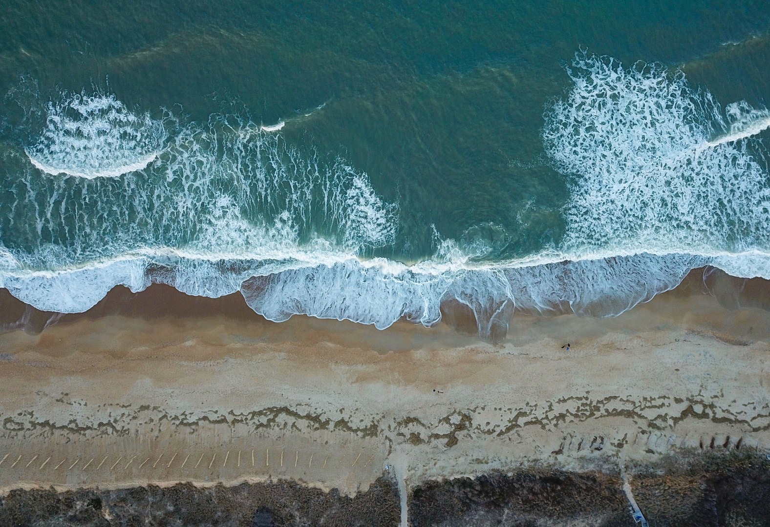 Waves crash on Kitty Hawk Beach
