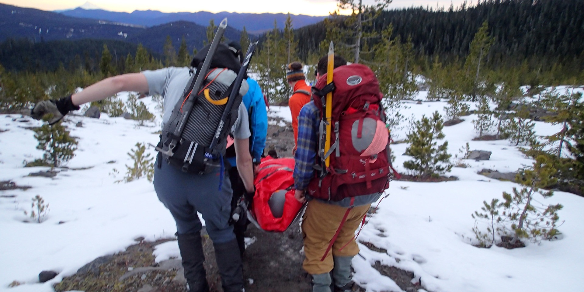 First responders rescue an injured woman on Mount St. Helens.